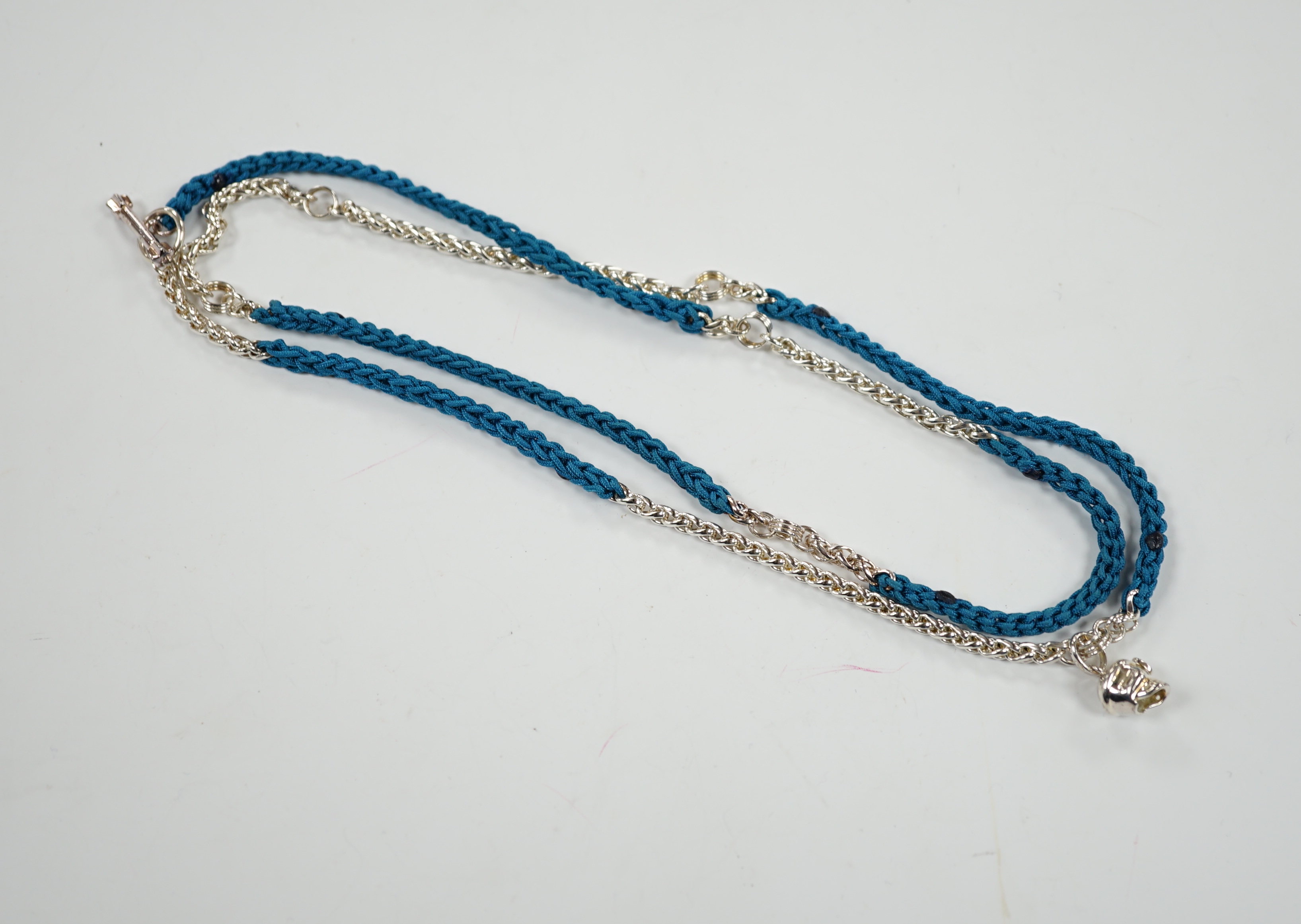 A modern Links of London, silver skull and heart pendant, 14mm, on a Links of London, silver link and rope twist thread chain, 90cm, in a Links of London box.